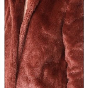 A fluffy faux-fur FRAME coat